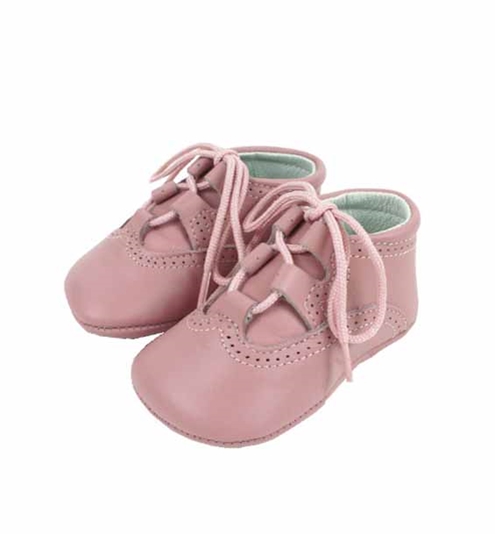 Baby shoes in pastel pink