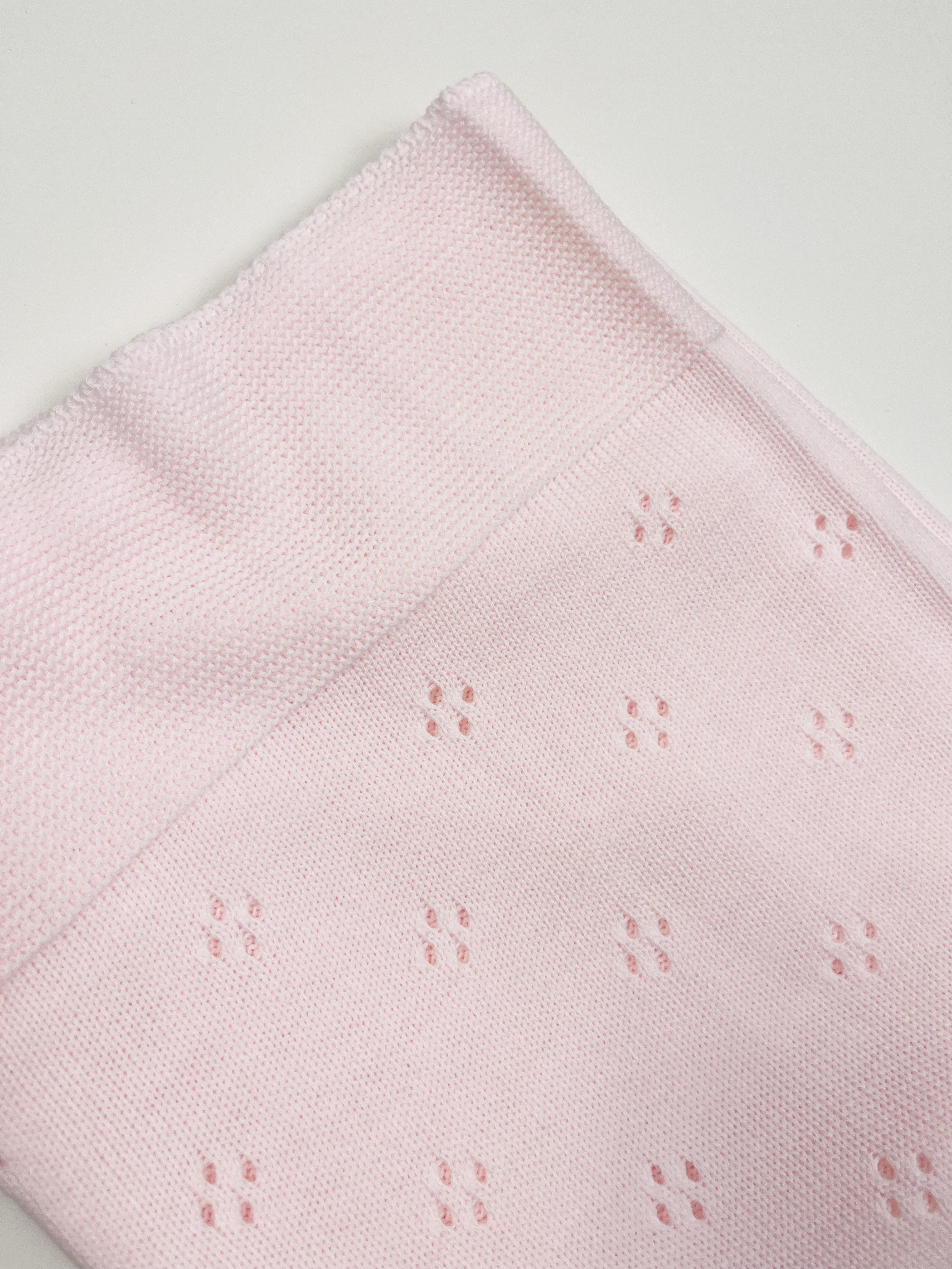 pink openwork blanket