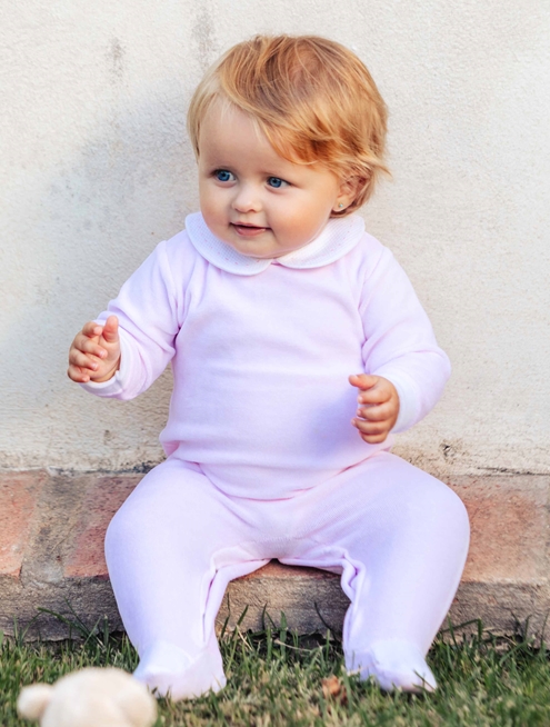 Pink velvet sleepsuit with polka dots